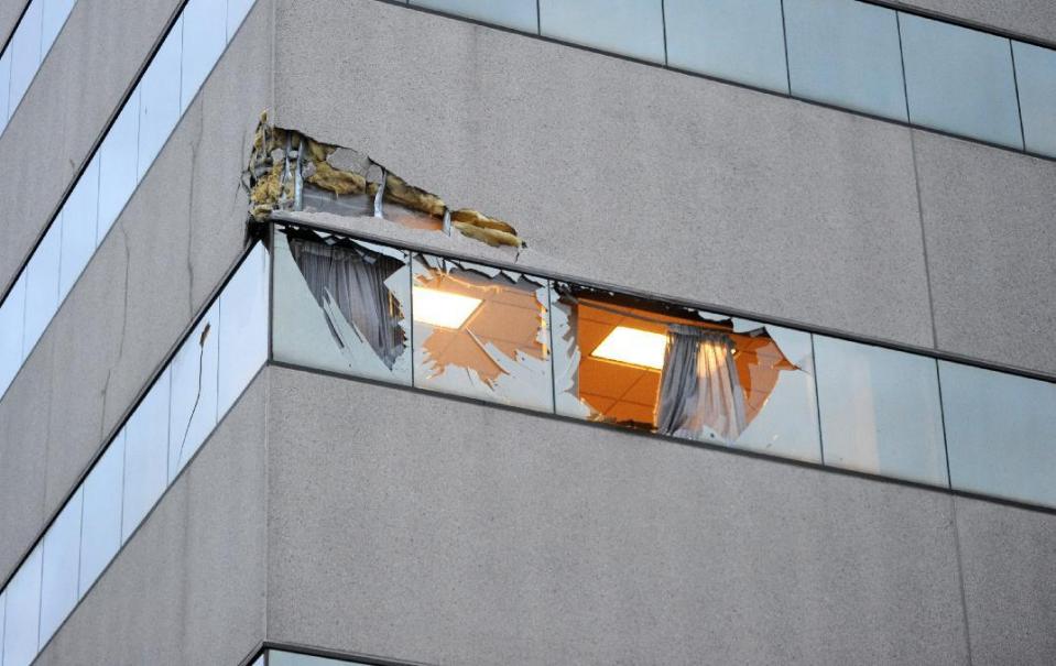 This Dec. 29, 2015 photo shows damage to the corner of The Brady Building after a small plane crashed into it in downtown Anchorage, Alaska. The pilot was not authorized to fly the aircraft used in volunteer search-and-rescue missions, authorities said. (Bob Hallinen/Alaska Dispatch News via AP) KTUU-TV OUT; KTVA-TV OUT; THE MAT-SU VALLEY FRONTIERSMAN OUT